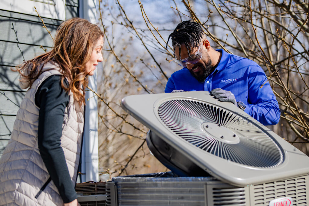 Santa Fe HVAC technician working on an AC unit
